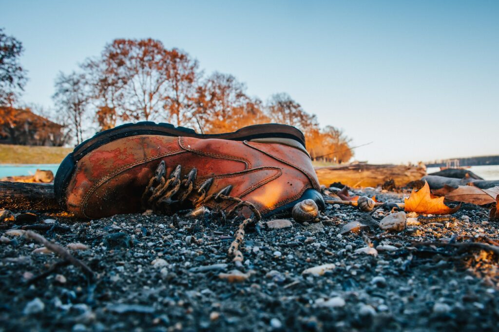 old shoe on beach scaled